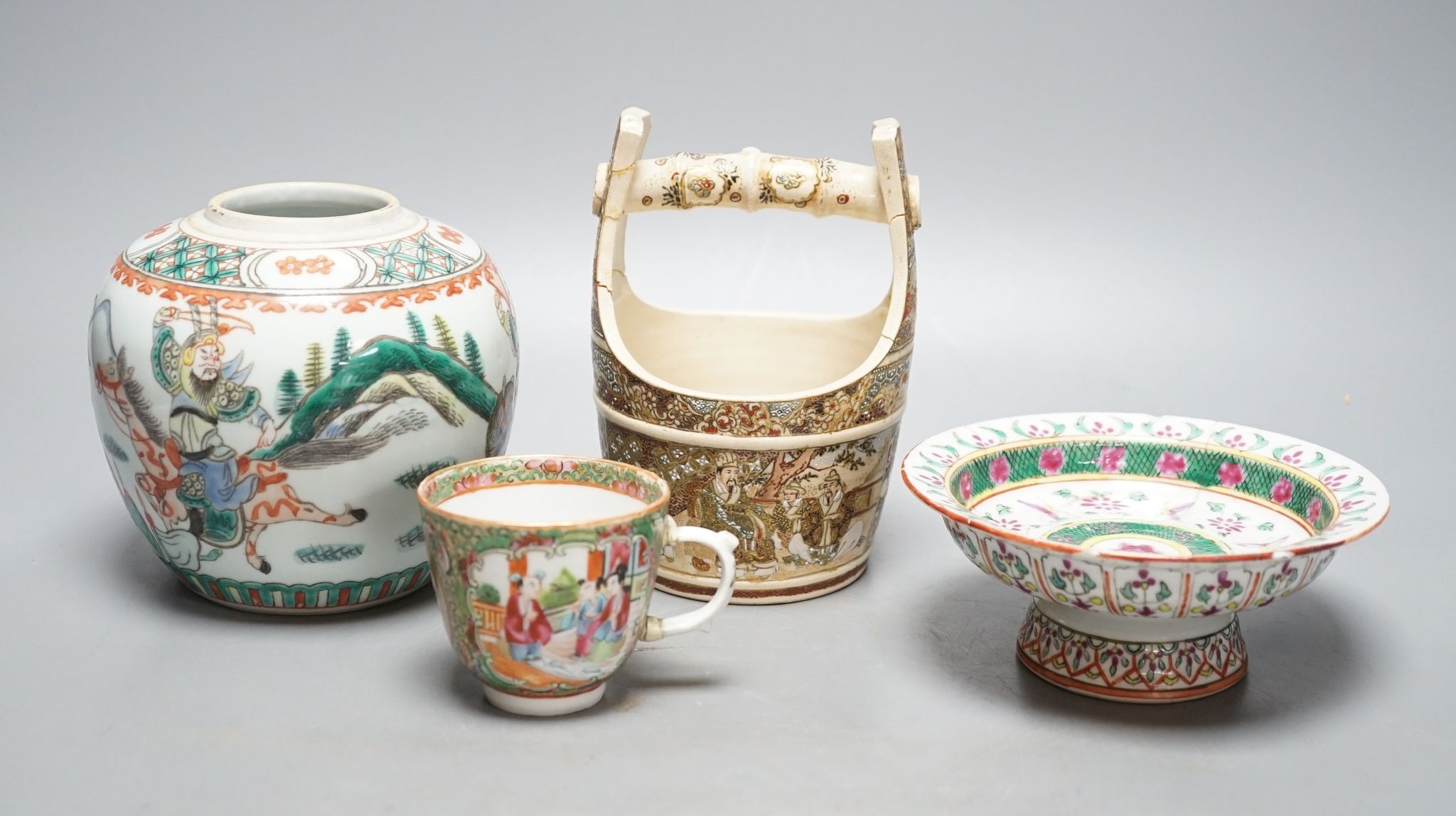 A Chinese famille verte jar, a Chinese enamelled porcelain stem dish, a famille rose cup and a Japanese Satsuma pottery model of a bucket, tallest 15.5cm